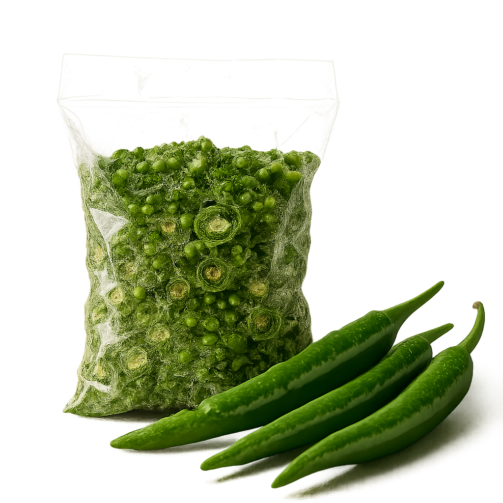 Transparent pouch filled with dehydrated green chilli flakes with fresh green chillies beside it