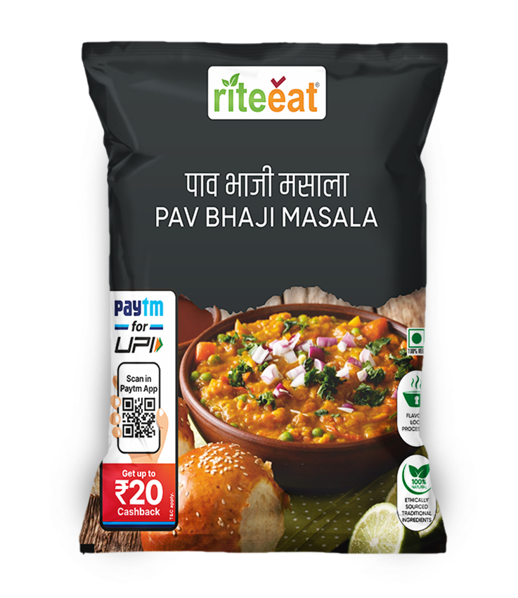 Pav Bhaji Masala spice blend in transparent loose pouch with bright red-orange tones beside a bowl of pav bhaji